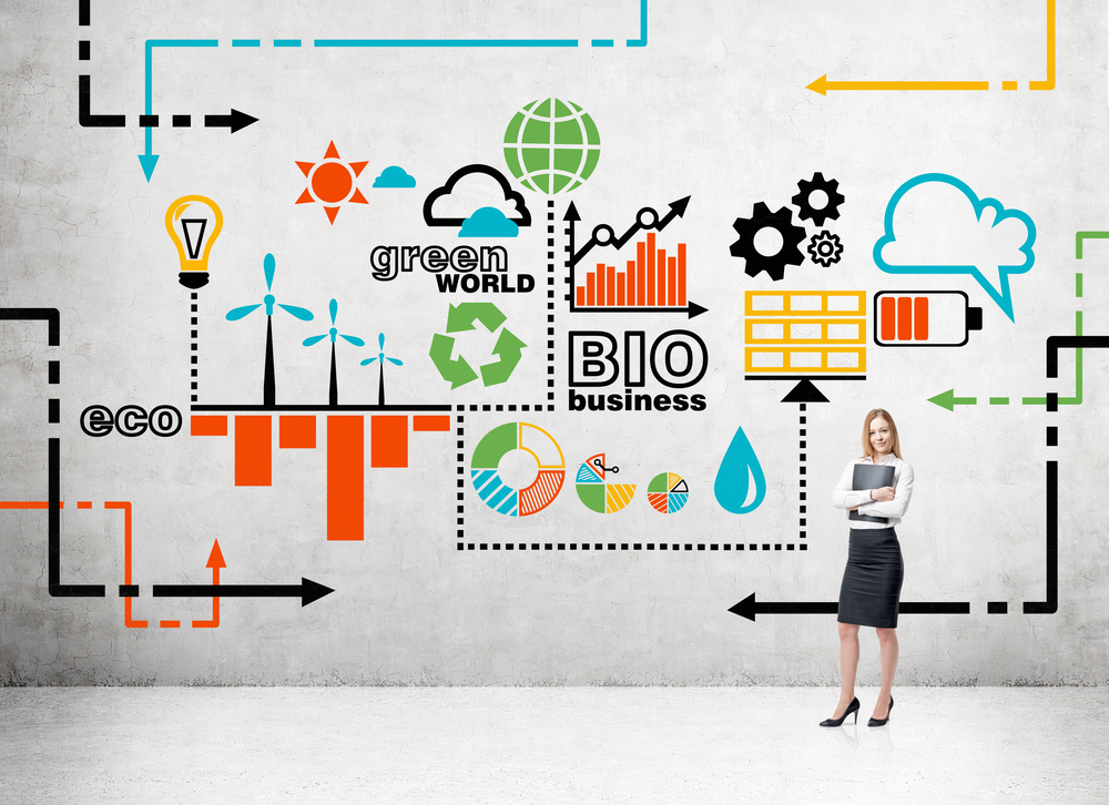 Woman,With,A,Folder,Standing,In,Front,Of,A,Coloured